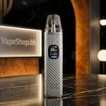 Black **Xlim Pro 2** OXVA pod vape with installed 0.8Ω pod, compact 67g design for daily SaltNic use.