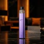 Compact **Geekvape Wenax K2** SaltNic device with LED indicators, Type-C port, 18W output in stylish pastel color.