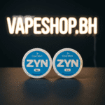 Stack of ZYN nicotine pouches cans, various strengths like 3mg and 6mg, all-white for Bahrain users.