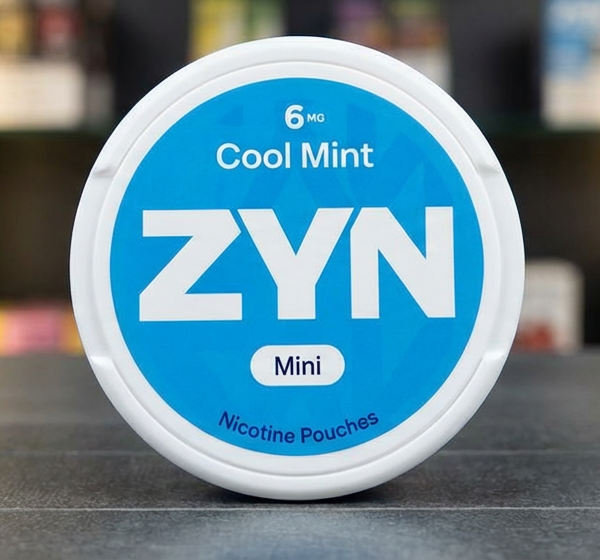 ZYN nicotine pouches tobacco-free pouch sitting between upper lip and gum