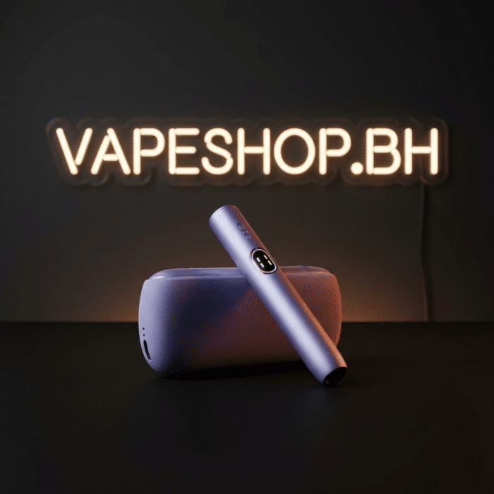 Pebble grey iqos iluma i holder inserted with terea stick, auto-start function, ergonomic bahrain vape alternative.