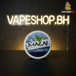 Sealed Mazaj Nicotine Pouches tin front-facing, premium black with flavor hints for Bahrain