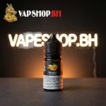 TRAND Saltnic vape juice bottle tilted to reveal glossy label and Bahrain-ready packaging