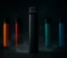 Elf Bar disposable vape devices with colorful flavors and vapor wisps in dramatic studio lighting