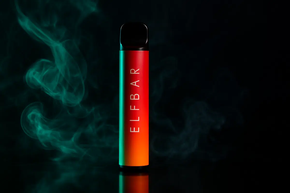 Elf Bar disposable vape hero image for Bahrain legal guide with dark dramatic lighting and vapor wisps.