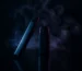 Vape products with vapor wisps in dramatic studio lighting for Seef District reviews